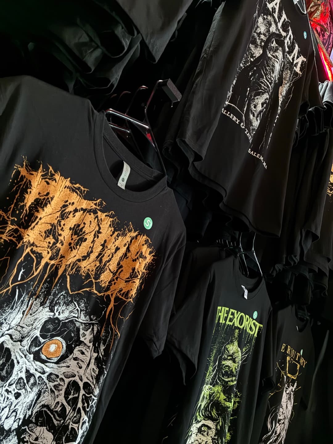 Apparel and prints on the racks inside Tomb Gallery in Salem