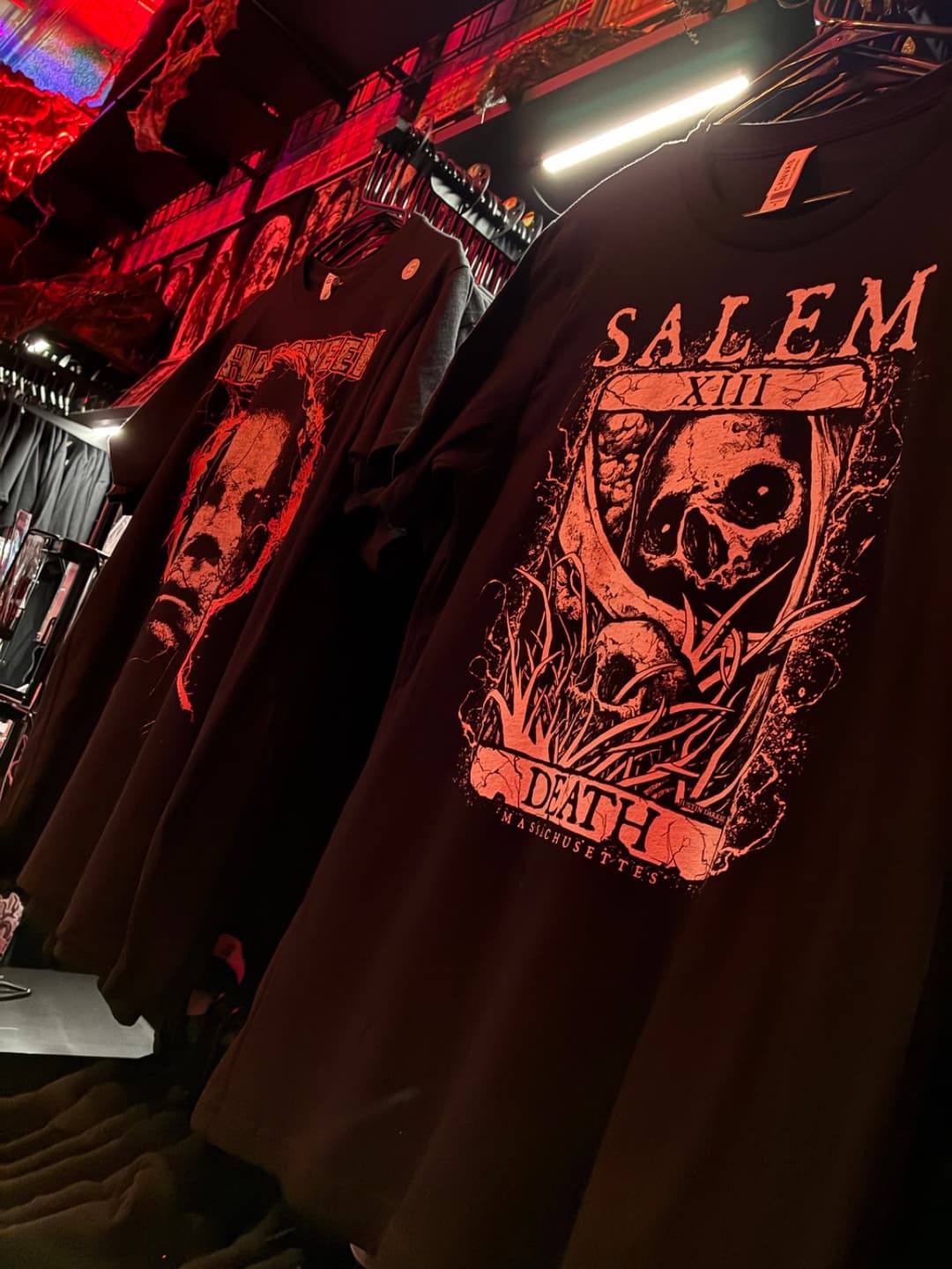 Apparel and prints on the racks inside Tomb Gallery in Salem
