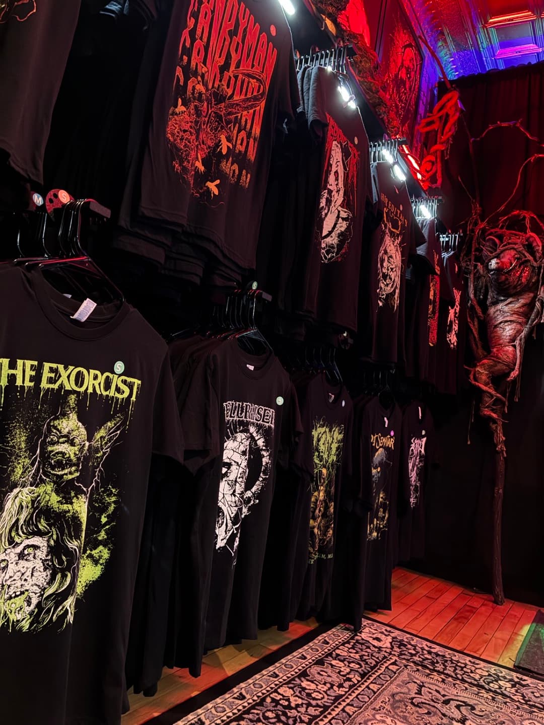 Apparel and prints on the racks inside Tomb Gallery in Salem