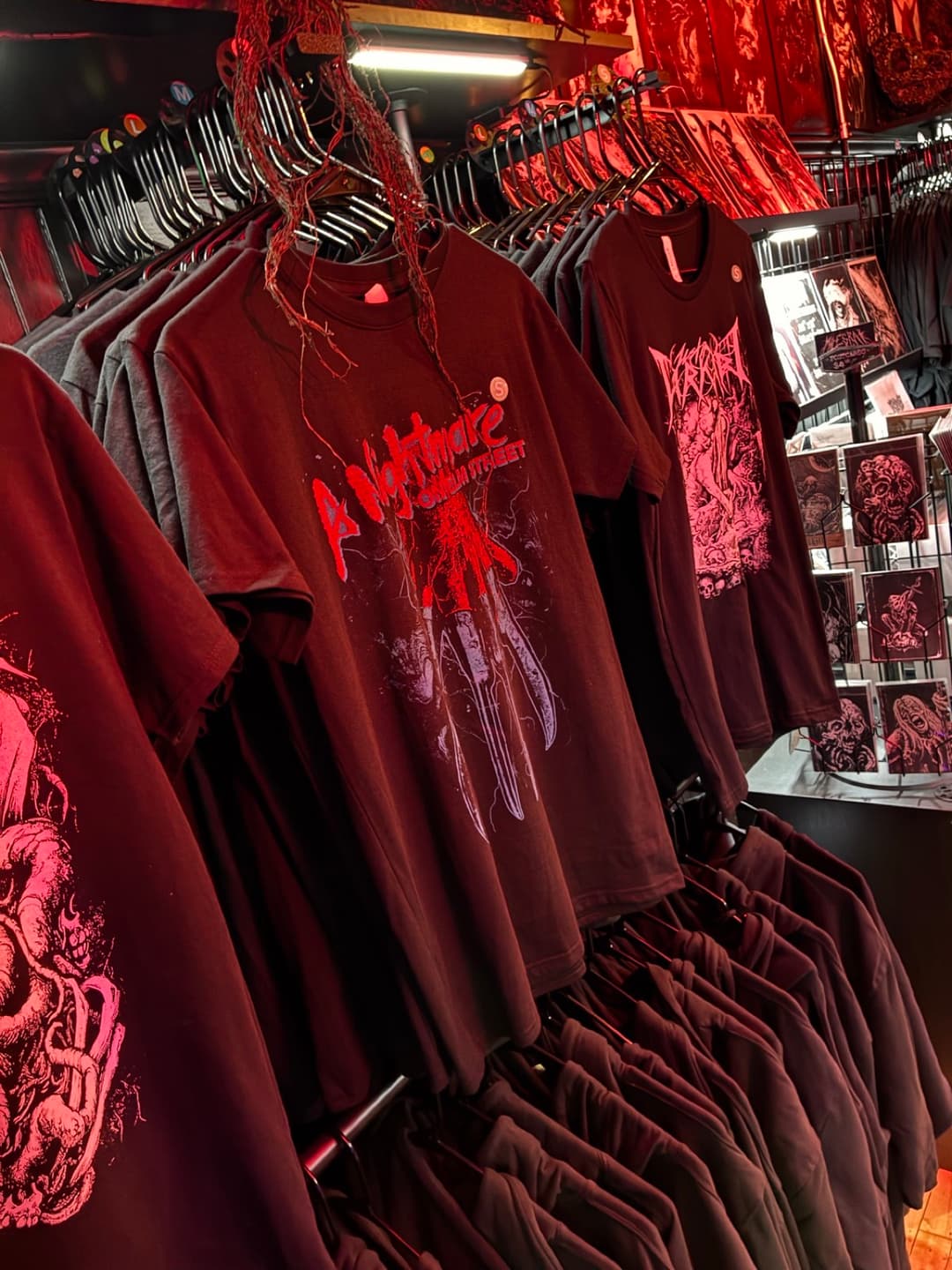 Apparel and prints on the racks inside Tomb Gallery in Salem