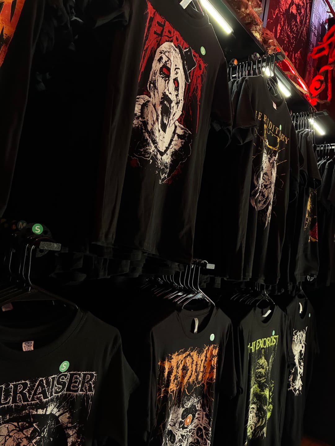 Apparel and prints on the racks inside Tomb Gallery in Salem