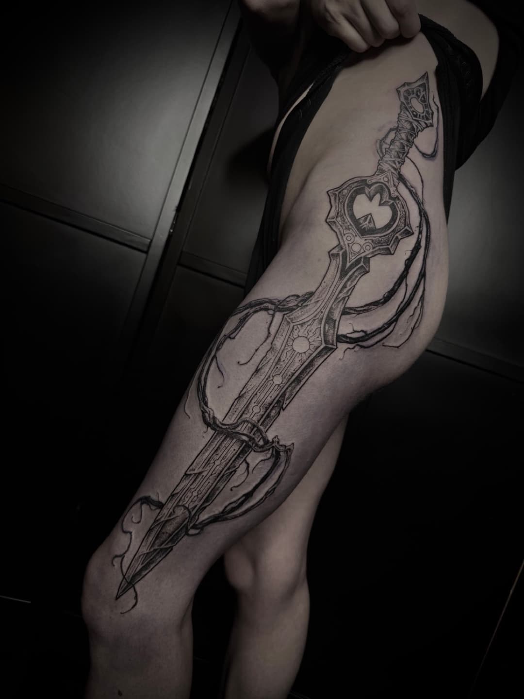 Dark illustrative tattoo by Miles at Tomb Gallery in Salem